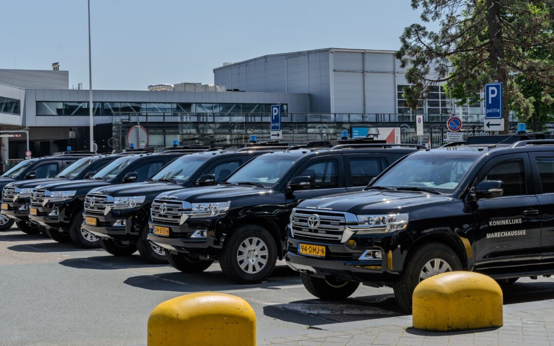 Row of black Toyota Land Cruiser SUVs parked outside, suitable as a Luxury SUV fleet for Wedding guest transportation or VIP event service.